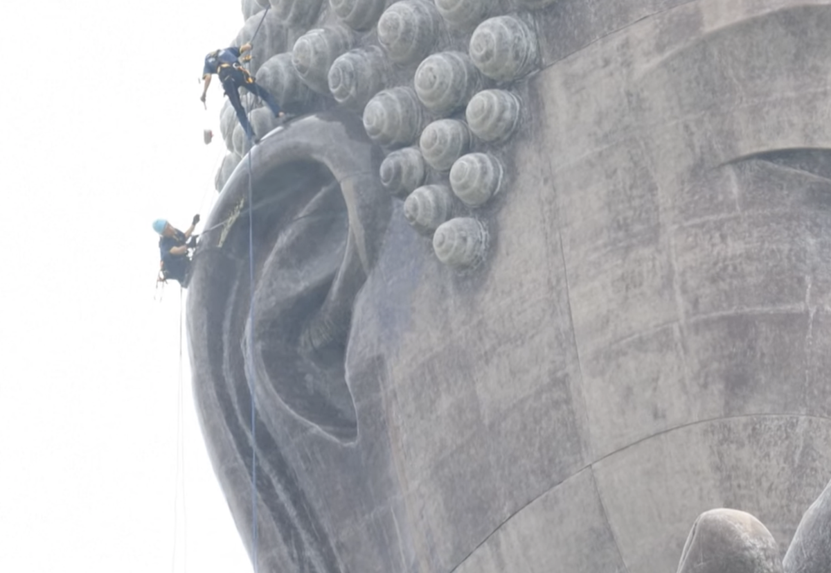two men and a pressure washer
